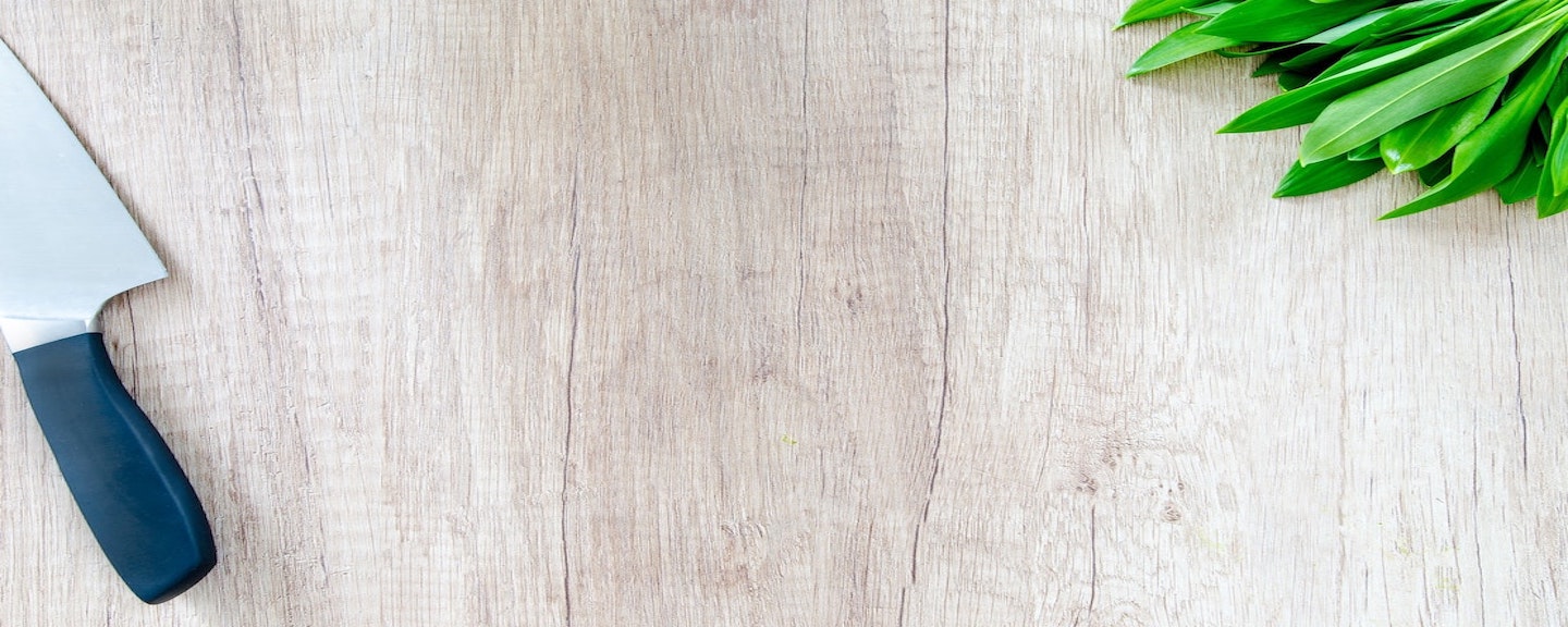 cover photo of chef's knife and herbs